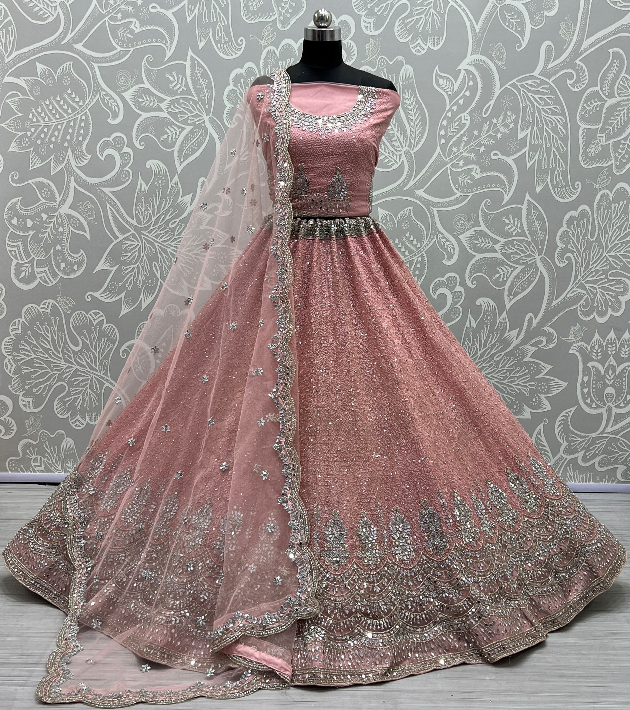 Invaluable Pink Sequins Embroidered Net Wedding Wear Lehenga Choli